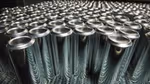 Aluminium cans are lined up ready to be supplied to Unilever for aerosols packaging.