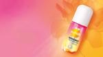 Sunsilk’s new WonderMist hair mist in Golden Glaze. A small pink and orange spray bottle on a pink and orange background.