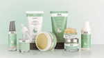 A range of REN Evercalm white and sage green bottles, tubes and jars that include biotech alternative ingredients