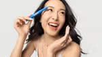A photo of creator Jen Chae holding the Vaseline Originals Brow Tamer Jelly product she helped Vaseline design.
