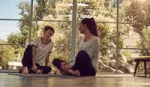 Two women drinking Lipton tea together after a yoga class