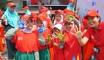 A group of children raise their hands whilst taking part of Lifebuoy’s handwashing programme