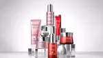 A selection of red and pink Pond’s skincare products in tubes and pots arranged in a pyramid shape.