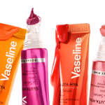 Four brightly coloured tubes of Vaseline Gluta Hya lip serum with product dripping from the tubes set on a white background.