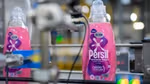 A bottle of Persil Wonder Wash laundry detergent on a factory production line. The innovation has been designed specifically for quick washes.