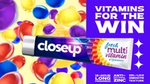A tube of Closeup Fresh Multi Vitamin toothpaste surrounded by colourful capsules. The text reads: “vitamins for the win”, highlighting benefits like 18-hour freshness, antibacterial zinc and gel-like texture.