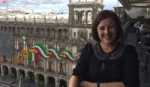 Unilever Hero Elaine Molina sitting on a outdoor table