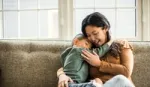 Mother and son hugging