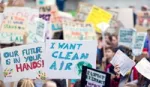 Image of children holding protest placards with Freedom to breathe on them