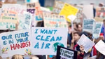 Image of children holding protest placards with Freedom to breathe on them