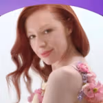 Unilever Q1 2026 results graphic on a blue‑to‑purple gradient background showing a person photographed against a light backdrop, wearing a floral‑detailed garment, positioned beneath a curved design element.