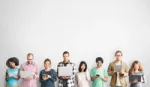 People in a row holding their devices