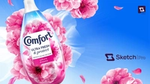 A bottle of Comfort fabric conditioner with pink cherry blossom flowers created with Sketch AI content creation.